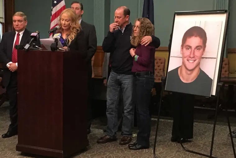 At podium is Stacy Parks Miller, Centre County district attorney, with the parents of Timothy Piazza, 19, of Lebanon, N.J. during a press conference at Bellefonte courthouse on Friday. Timothy's parents are James and Evelyn Piazza.