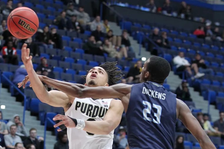 Carsen Edwards, left, of Purdue goes up for a basket against Dajour Dickens of Old Dominion in a first round NCAA Tournament game at the XL Center in Hartford, CT on March 21, 2019.