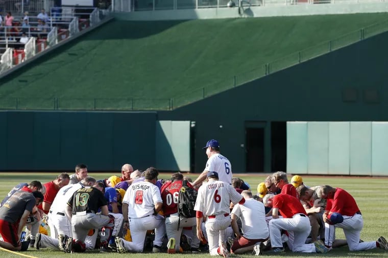 Steve Garvey, former Los Angeles Dodgers player, leads a prayer for the Republican team before the Congressional baseball game