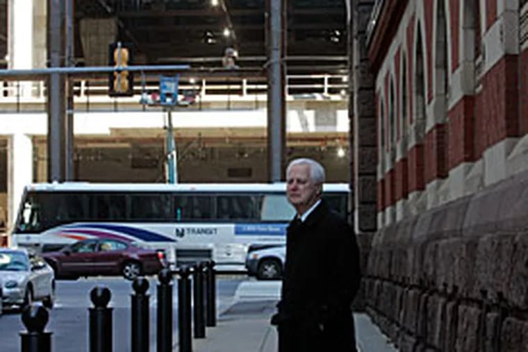 Ted Lewis, president, PA Academy of Fine Arts stands next to the Academy museum. Behind him is the construction of the Pa. Convention Center. ( Bonnie Weller / Staff Photographer )