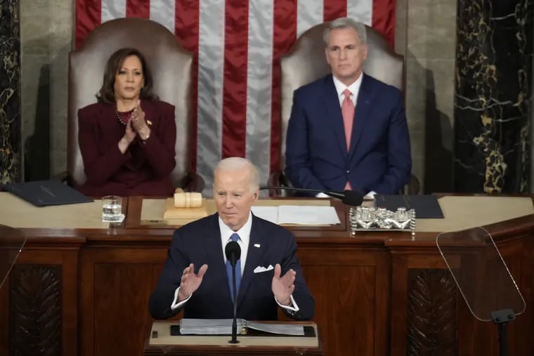 President Joe Biden speaks as Vice President Kamala Harris, left, and Speaker of the House Kevin McCarthy (R-CA), right, listen during the State of the Union address on Feb. 7, 2023.