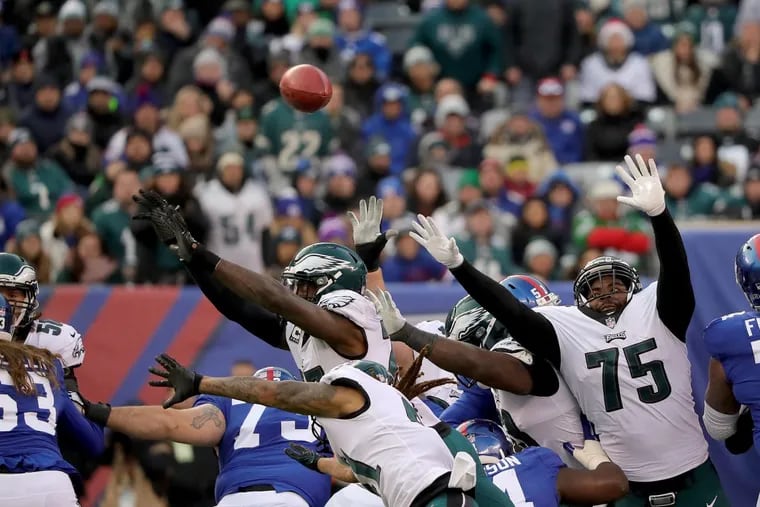 Eagles’ Malcolm Jenkins, center, blocks a Giants’ field goal attempt in the 4th quarter. Philadelphia Eagles win 34-29 over the New York Giants in East Rutherford, New Jersey on December 17, 2017. DAVID MAIALETTI / Staff Photographer