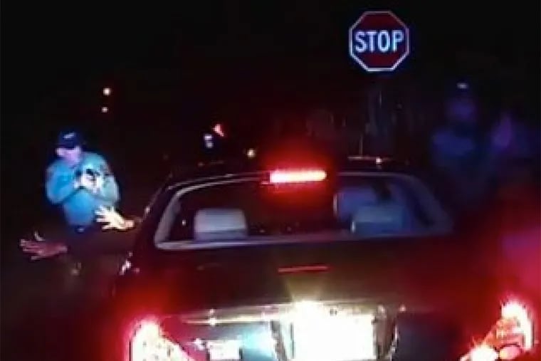 A screenshot of police dash cam video shows Jerame Reid before he was fatally shot by Bridgeton officer Braheme Days during a traffic stop. Days was not indicted, and Reid's family are calling for a federal investigation.