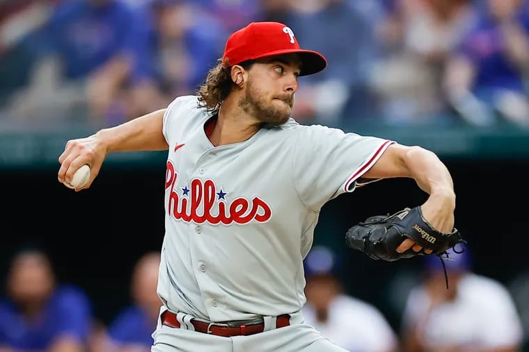 Aaron Nola pitches on opening day. He gave up five earned runs in 3⅔ innings against the Rangers.