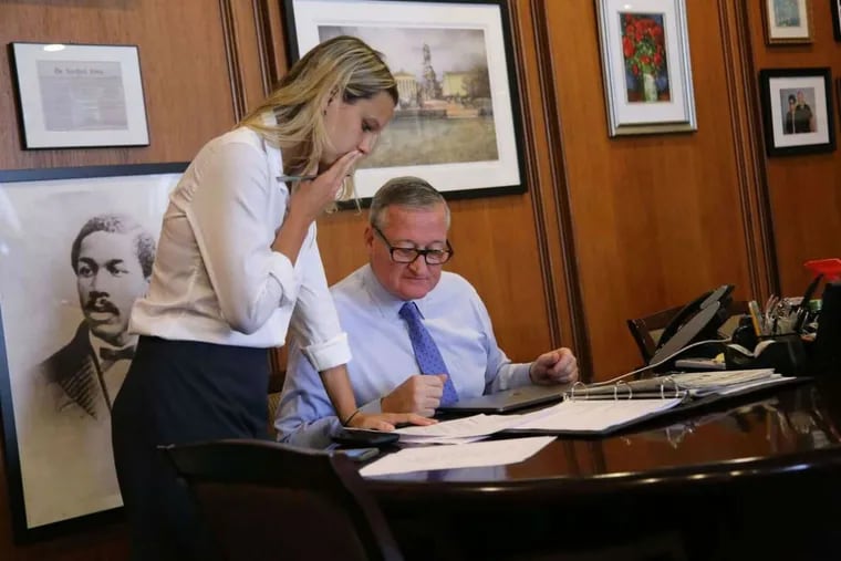 Mayor Kenney and Lauren Hitt, his director of communications, talk in his office at City Hall. Hitt is leaving the administration after two years to work on the congressional campaign of Democrat Randy Bryce, who is challenging Speaker of the House Paul Ryan.