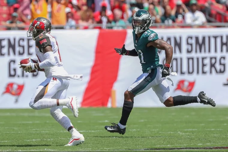 The eagles jalen Mills, right, can't catch up to Tampa Bay's DeSean Jackson as he streaks toward the end zone on the first play from scrimmage, a 75 yard pass play from Ryan Fitzpatrick during Sunday's game. The Philadelphia Eagles lost to the Tampa Bay Buccaneers 27-21 on Sunday September 16, 2018. MICHAEL BRYANT / Staff Photographer