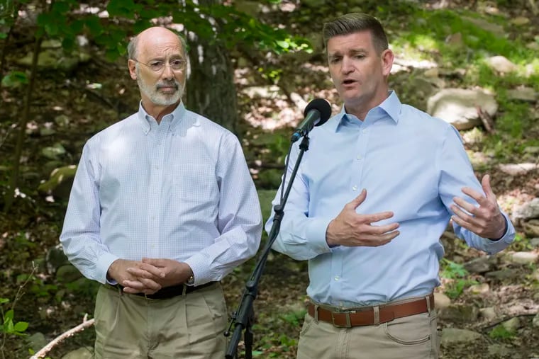 Pennsylvania Senator John T. Yudichak talks to the press at the base of the Falls Trail at Glen Onoko Falls in Jim Thorpe, Pennsylvania as Governor Tom Wolf stands by his side Tuesday, May 21, 2019.