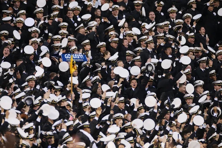 Navy midshipmen celebrate a touchdown during the 120th Army-Navy game at Lincoln Financial Field in South Philadelphia.