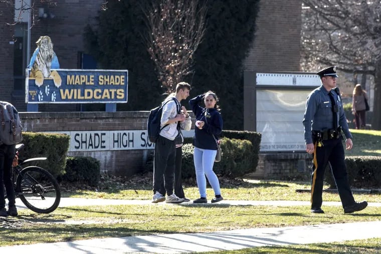 Students leave Maple Shade High School at the end of the school day Tuesday, amid reports of students hurling racist taunts and racial epithets at classmates via social media.
