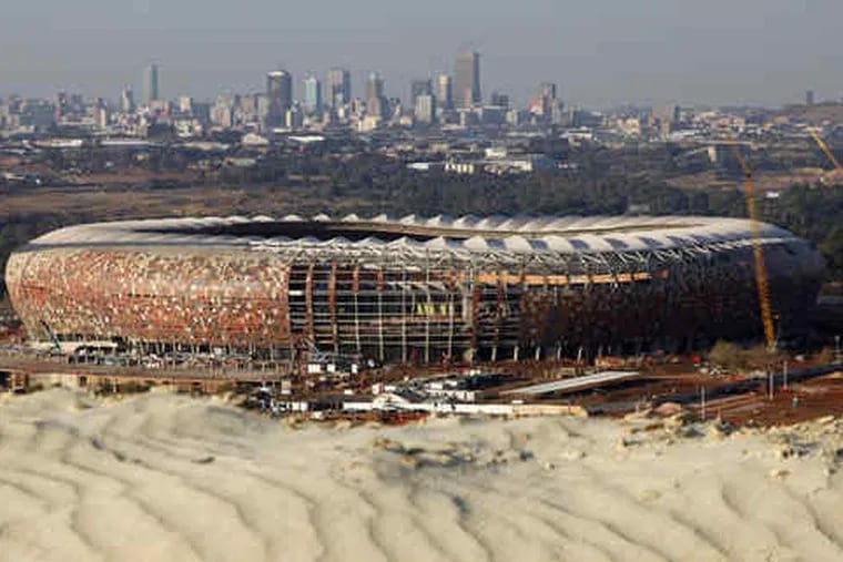 Soccer City Stadium is under construction in Soweto, just outside Johannesburg. The final of the 2010 World Cup will be played there.