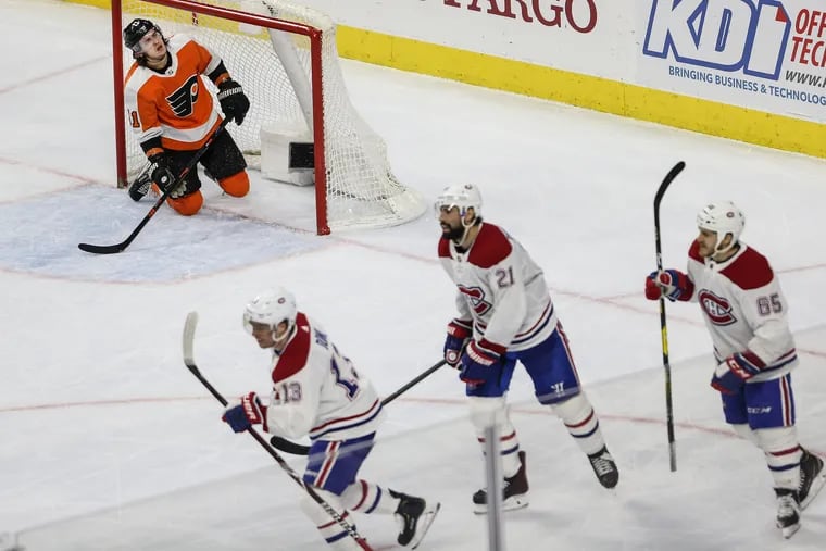 Travis Konecny couldn't stop the empty-net goal of the Canadiens' Max Domi (13) on Tuesday night.