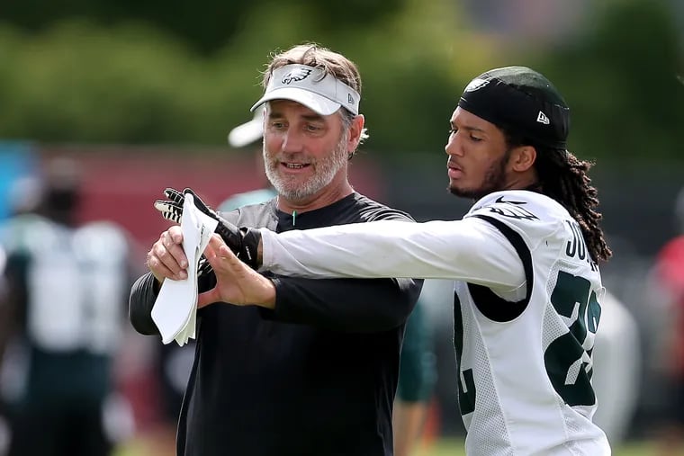 Eagles' defensive backs coach Cory Undlin, left, works with Sidney Jones, right, during Eagles training camp in Philadelphia, PA on August 14, 2018. DAVID MAIALETTI / Staff Photographer