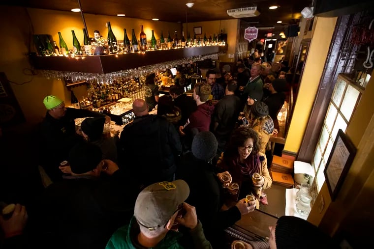 People filling the bar during "Pliny the Younger Day" at Monk's Cafe on Feb. 17, 2020.