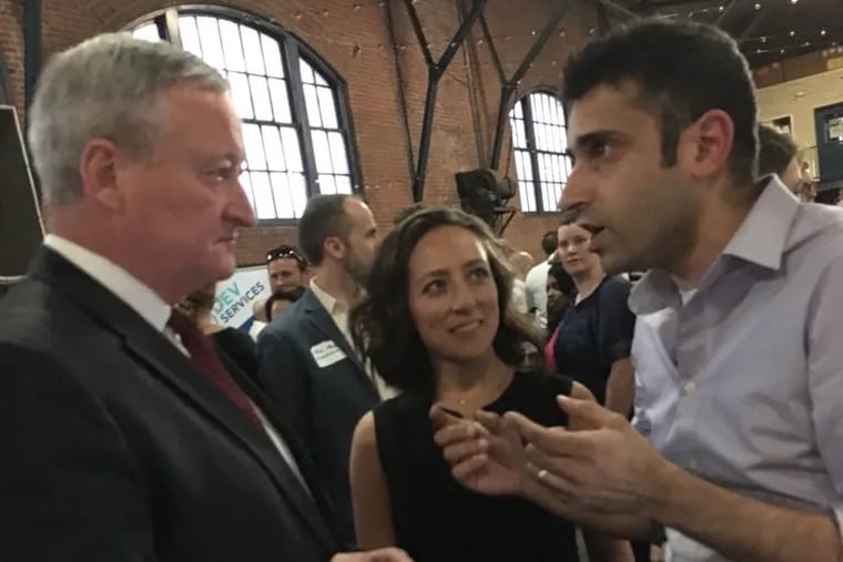 SocialLadder CEO Raavi Iqbal (right) speaks with Philadelphia Mayor Jim Kenney