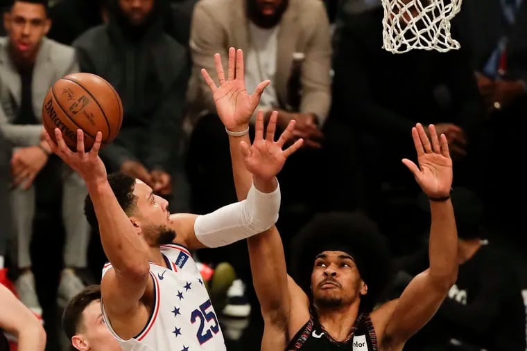 Sixers guard Ben Simmons shoot the basketball Brooklyn Nets center Jarrett Allen during the first-quarter in game three of the Eastern Conference playoffs on Thursday, April 18, 2019 in Brooklyn.