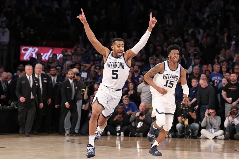Phil Booth, left, and  Saddiq Bey of Villanova at the end of their victory over Seton Hall in the Big East Tournament Championship on March 16, 2019.    