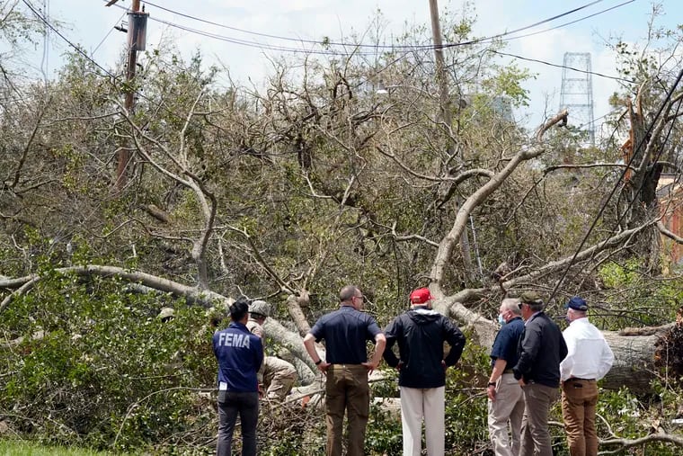 President Donald Trump looks at damage caused by Hurricane Laura as he tours the area, Saturday, Aug. 29, 2020, in Lake Charles, La. (AP Photo/Alex Brandon)