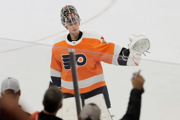 Flyers goalie Carter Hart waves to the crowd after his 4-0 shutout of the New Jersey Devils on Wednesday night. He made 25 saves.