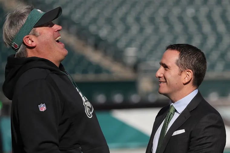 Eagles coach Doug Pederson (left) and GM Howie Roseman haven't been perfect, but they don't deserve to be fired, either.