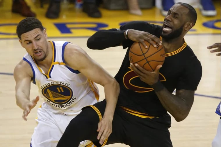 Golden State's Klay Thompson fouls Cleveland's LeBron James in the third quarter of Game 2 of the NBA Finals on Sunday. The last tweet from James was on April 14. Thompson last tweeted Monday afternoon.