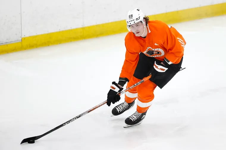 Flyers defenseman Oliver Bonk skates with the puck during a development camp scrimmage game at the Flyers Training Center in Voorhees on July 6.