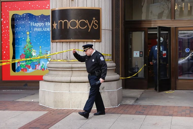 A Philadelphia Police officer outside Macy's in Center City after a stabbing at the store.
