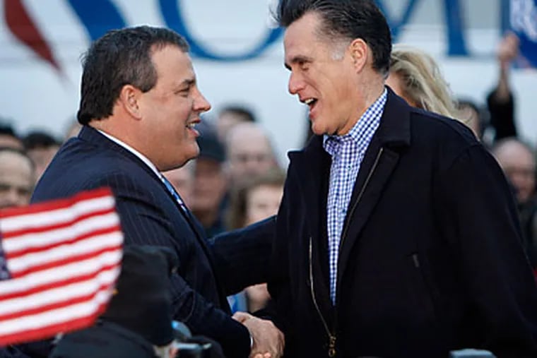 Republican presidential candidate, former Massachusetts Gov. Mitt Romney shakes hands with New Jersey Gov. Chris Christie during a campaign appearance in West Des Moines, Iowa. (AP Photo/Evan Vucci)