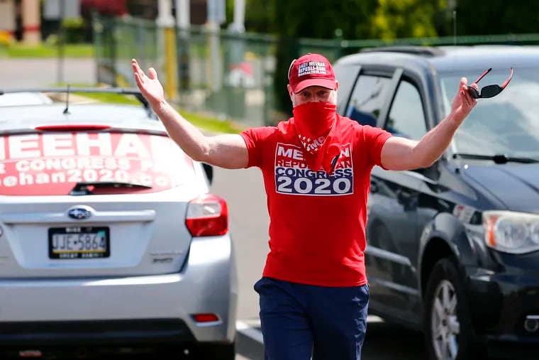 Andy Meehan, a challenger to U.S. Rep. Brian Fitzpatrick in the June 2 Republican primary, greeting people during a rally at the Trump Store in Bensalem on May 16.