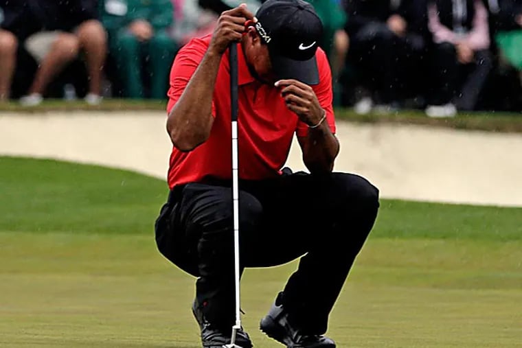 Tiger Woods finished tied for fourth, four strokes out of a playoff. Four strokes that fate, and ignorance, and sloppy adjudication combined to rob him of a shot at a 15th major. (David J. Phillip/AP)