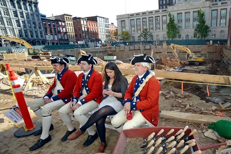 At the ceremonial groundbreaking for the $120 million Museum of the American Revolution, members of the Fifes and Drums of the Old Barracks from Trenton wait for their cue. ( TOM GRALISH / Staff Photographer )