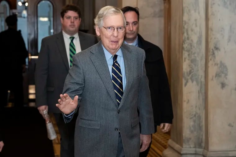 Senate Majority Leader Mitch McConnell of Ky., waves as he arrives on Capitol Hill, Monday, Feb. 3, 2020 in Washington.