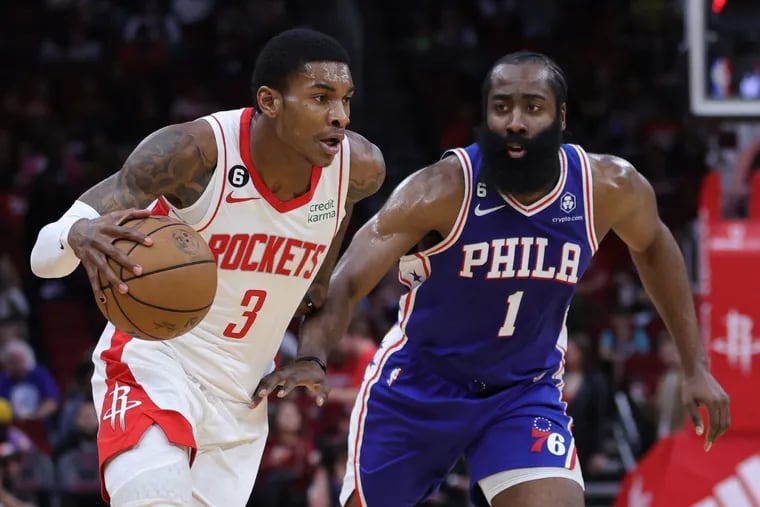 Kevin Porter Jr. of the Houston Rockets controls the ball ahead of James Harden of the 76ers during the first half.