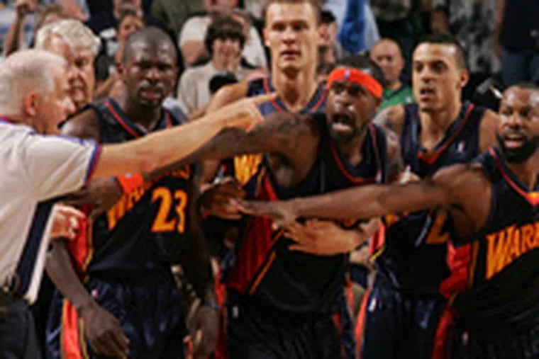 Bennett Salvatore calls technical fouls on the Warriors&#0039; Stephen Jackson (center) and Baron Davis (right) in Game 2 of their series against the Mavericks.