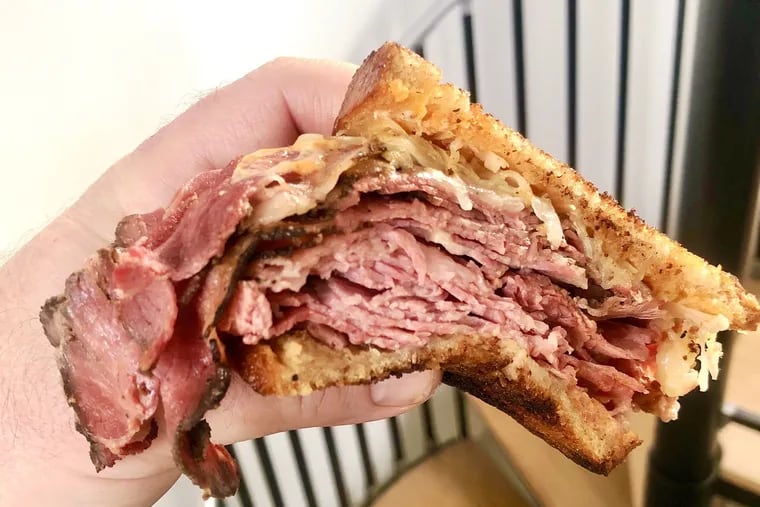 A corned beef and pastrami Reuben from Schlesinger's Deli. A new method for cooking the corned beef has been among the subtle changes recently that have improved the Rittenhouse Square standby.