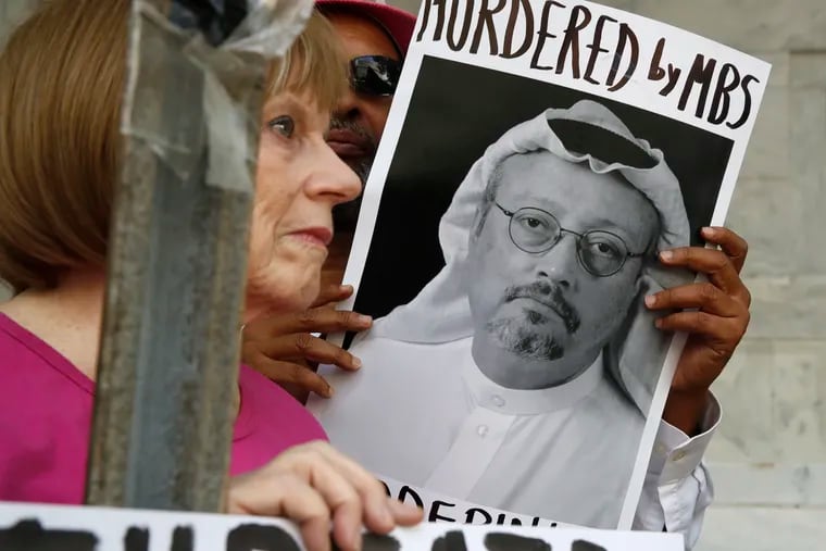 In this Oct. 10, 2018, file photo, people hold signs during a protest at the Embassy of Saudi Arabia about the disappearance of Saudi journalist Jamal Khashoggi, in Washington. (AP Photo/Jacquelyn Martin, File )
