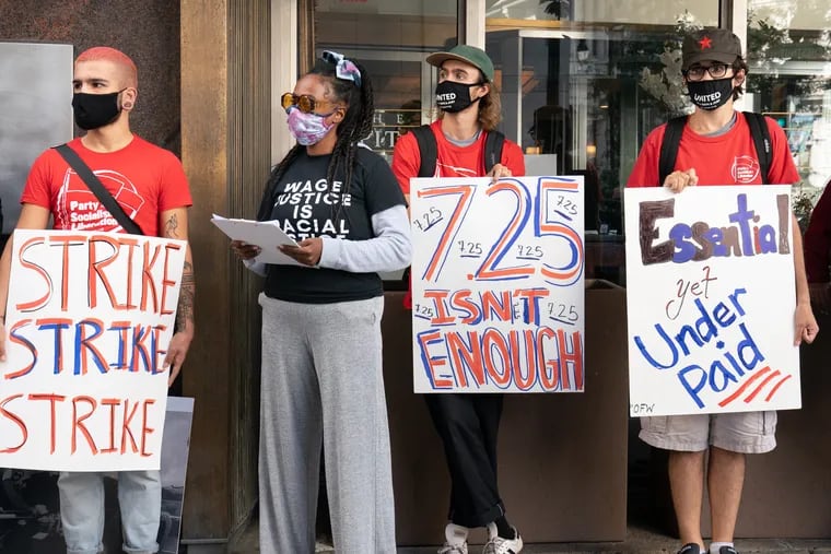 Restaurant workers in Philadelphia demonstrate at Broad and Chestnut Streets demanding a $15 minimum wage for all workers, in this 2020 photo.