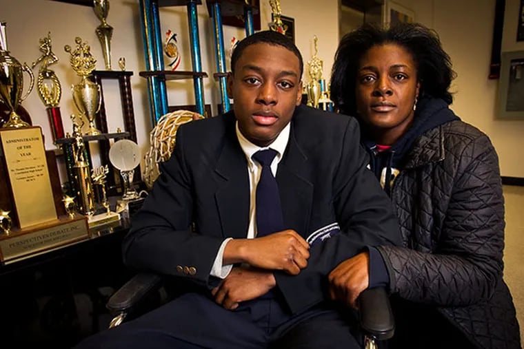 Darrin Manning, a student at Math Civics Science Charter school, was allegedly hurt during an arrest by Philadelphia police. Photograph with his mother Ikea Coney at the school on Monday, January 13, 2014. ( ALEJANDRO A. ALVAREZ / STAFF PHOTOGRAPHER )