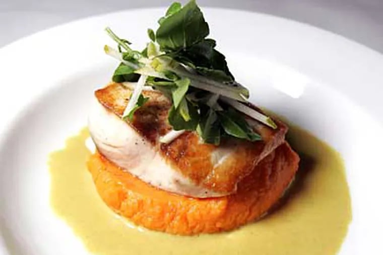 Mahimahi with sweet potato puree, watercress and pear garnish, and Madras curry. There is a simplicity to the best dishes here, plus a knowing tweak or smart seasonal pairing. (DAVID SWANSON / Staff Photographer)