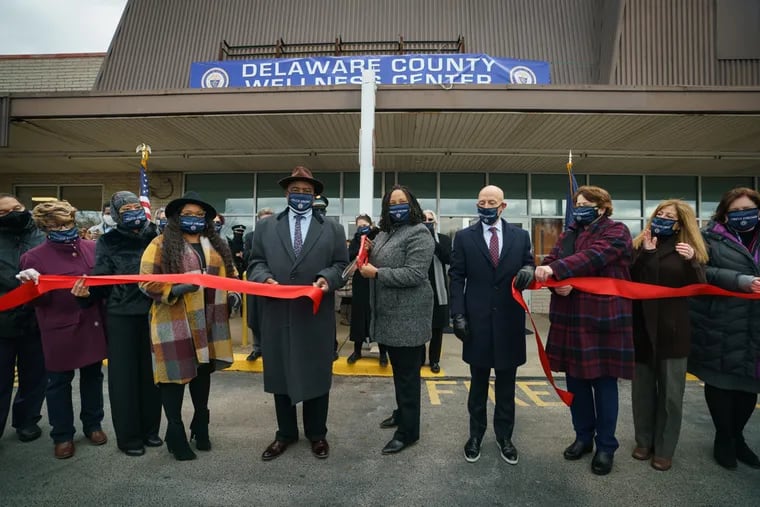(From center left) Yeadon Mayor Rohan Hepkins, Delaware County Council Vice Chair Monica Taylor, Delaware County Council Chair Brian Zidek, and other dignitaries at a ribbon-cutting ceremony at the opening of the Delaware County Wellness Center in January.