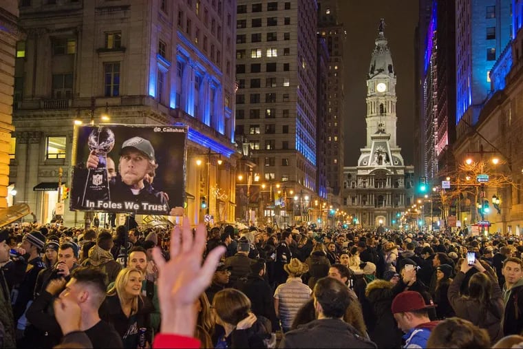 Fans at Broad and Walnut Streets celebrate the Eagles going to the Super Bowl.