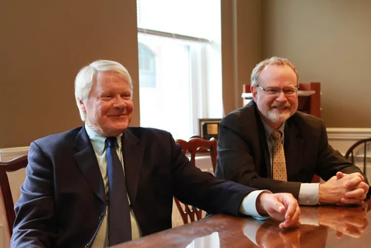 Of Sandusky trial fame, Joseph McGettigan, left, is now a lawyer with Dennis McAndrews, at the McAndrews law firm, in Berwyn, August 9, 2013. (DAVID SWANSON/Staff Photographer)
