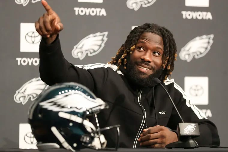 New Eagles wide receiver Zach Pascal points to a basketball hoop, installed in the auditorium, while meeting with the media at the NovaCare Complex on Thursday, March 24, 2022.  Pascal was explaining his competitive nature with Eagles Head Coach Nick Sirianni.