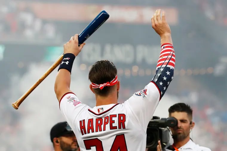 Bryce Harper waves to fans during the Home Run Derby at Nationals Park last year.