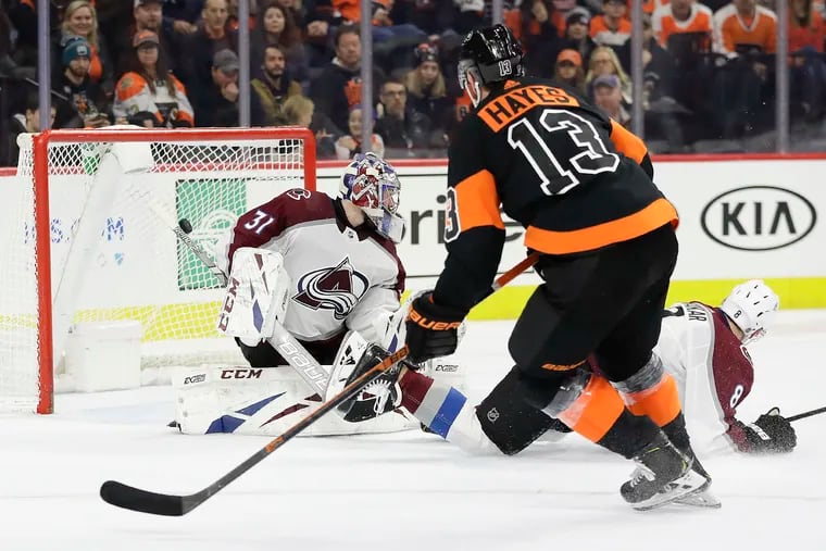 Flyers center Kevin Hayes scores a third-period shorthanded goal past Colorado goaltender Philipp Grubauer and defenseman Cale Makar on Feb. 1.