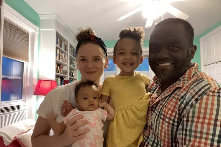 Cait and Matthew with daughters Bennu (left) and Adia.