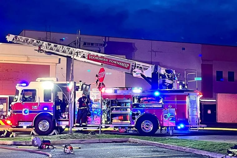 Firefighters respond to fire inside the Voorhees Town Center mall Friday evening. No injuries were reported, but the shopping center will be closed for the weekend.
