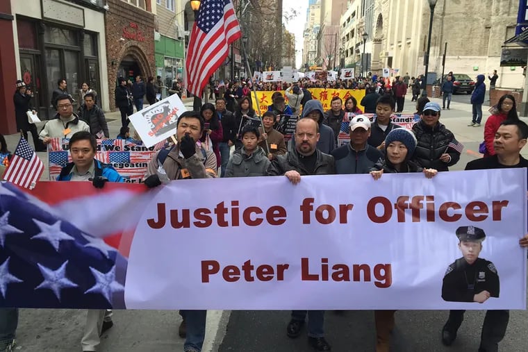 Thousands march in Center City Philadelphia on Saturday morning in support of former New York police officer Peter Liang.