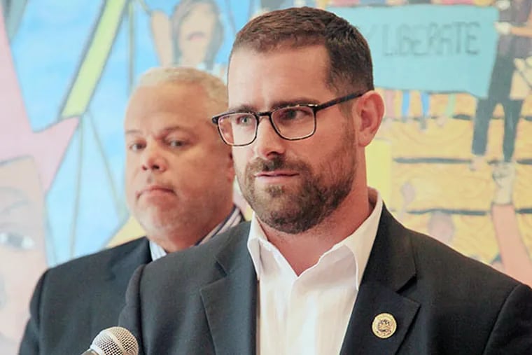 State Rep. Brian Sims, front right, and Sen. Anthony Williams, back left, Philly Democrats, announced plans to introduce a bill banning anti-gay conversion therapy for minors at the Attic Youth Center in Center City, Philadelphia, September 17th, 2013.  Sims plans to introduce the measure with Rep. Gerald Mullery, D-Luzerne. ( Jad Sleiman / Daily News Staff )