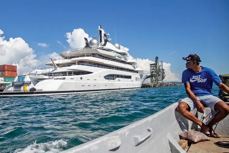 Boat captain Emosi Dawai looking at the superyacht Amadea when it was docked at the Queens Wharf in Lautoka, Fiji, on April 13.