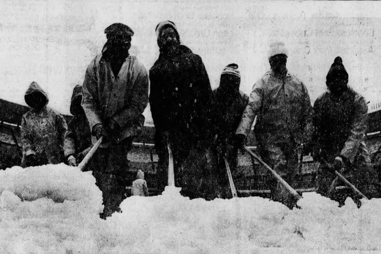 Ground-crew members remove snow from Veterans Stadium on April 6, 1982, the day the baseball season didn't open.